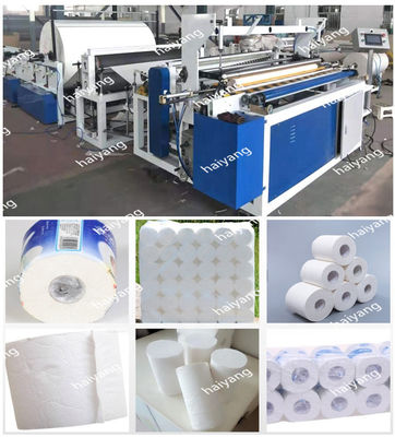 El convertir de papel automático el rebobinar del rollo de papel higiénico haciendo la máquina con la perforación y la grabación en relieve